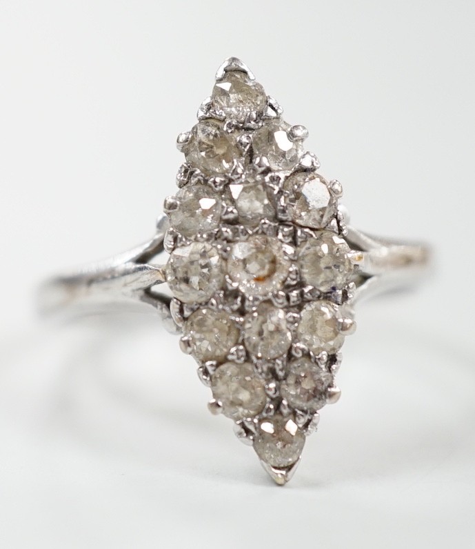 A mid 20th century 18ct white metal and diamond set marquise cluster ring, size P, gross weight 2.6 grams.
